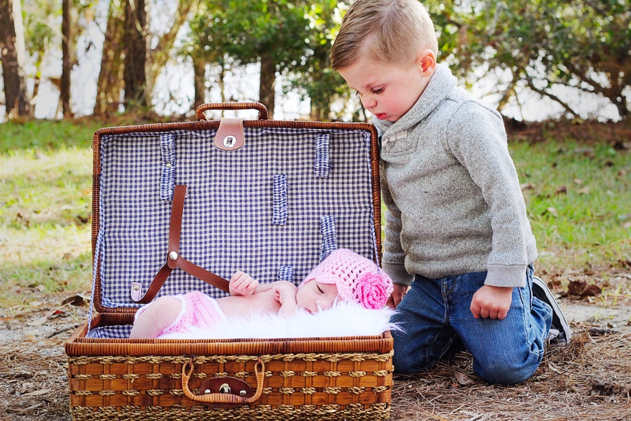 Bryden is registered to the contest to win money with this photo: basket, child, fun, girl, grass, infant, person, photograph, photography, picnic, play, product, recreation, sitting, toddler