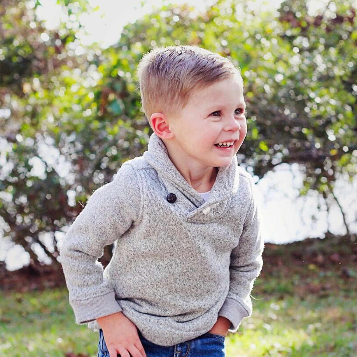 Bryden is registered to the contest to win money with this photo: boy, child, facial_expression, fun, girl, grass, happiness, joy, outerwear, people, person, photograph, photography, portrait, portrait_photography, sitting, skin, smile, standing, sweater