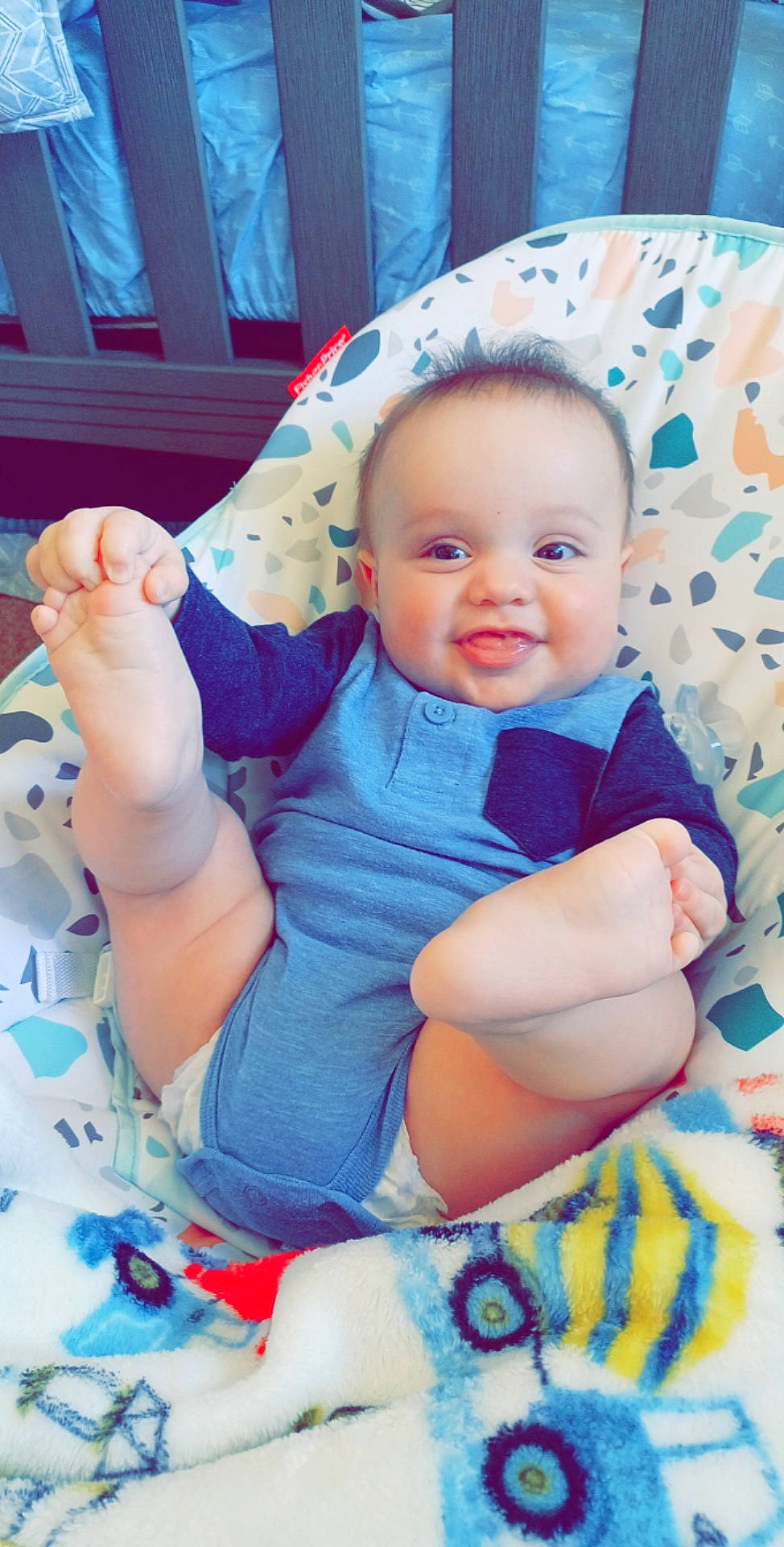 Odin is registered to the contest to win money with this photo: azure, baby, baby_toddler_clothing, blue, cheek, comfort, eye, finger, hand, happy, head, mouth, person, pink, product, purple, skin, sleeve, smile, textile