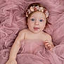 baby, infant, child, pink_tulle, flower_headband, blue_eyes, portrait, cute, soft_fabric, smiling, happy, skin, hand, face, lying_down, newborn, innocent, adorable, gentle_light, closeup