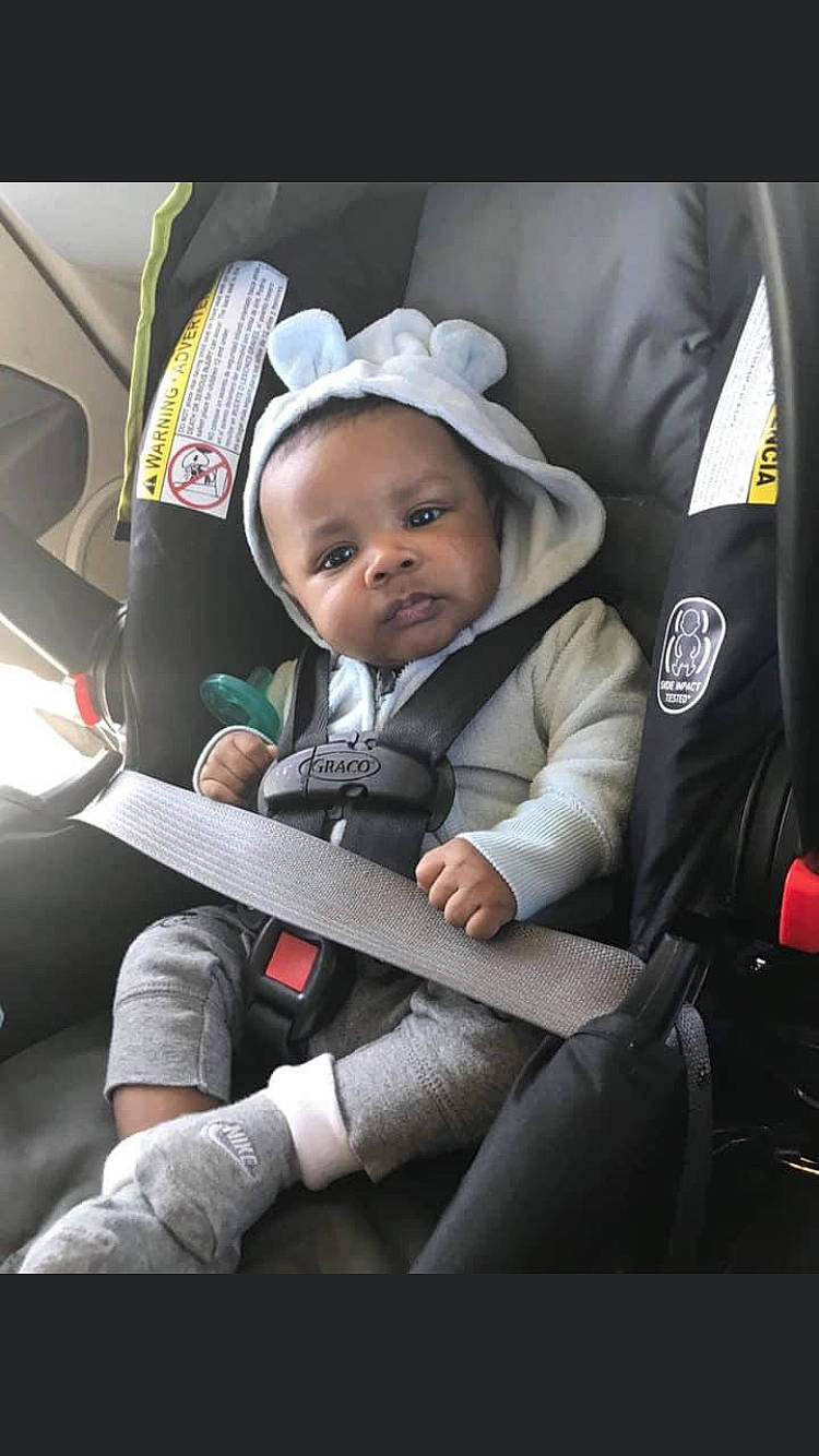 Noah is registered to the contest to win money with this photo: auto_part, automotive_design, baby, baby_carriage, baby_products, baby_safety, baby_toddler_clothing, car_seat, car_seat_cover, child, comfort, family_car, hat, head_restraint, luxury_vehicle, motor_vehicle, person, seat_belt, sitting, toddler
