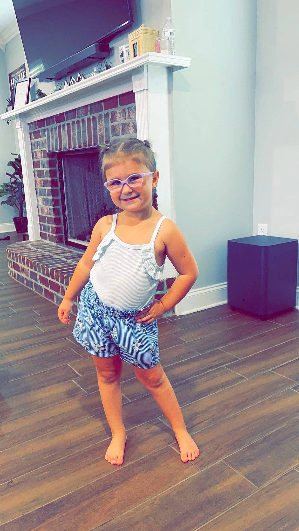 Demi is registered to the contest to win money with this photo: barefoot, child, electric_blue, fashion_design, floor, flooring, fun, happy, hardwood, human_leg, joint, joy, knee, leisure, person, shoulder, smile, standing, thigh, trunk