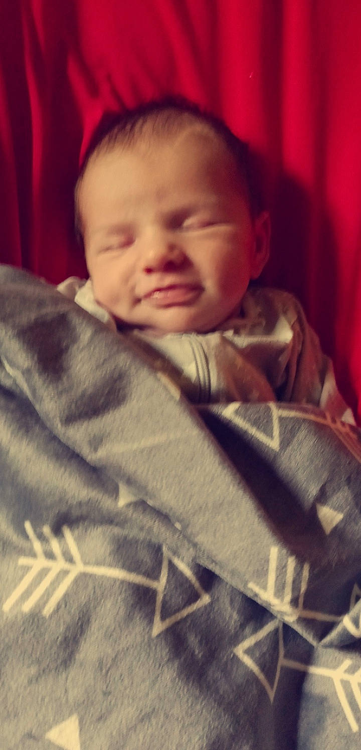 Phoenix is registered to the contest to win money with this photo: baby, baby_toddler_clothing, bedtime, cheek, child, chin, comfort, cool, eyebrow, facial_expression, forehead, hairstyle, linens, mouth, nose, person, skin, sleeve, smile, tints_and_shades