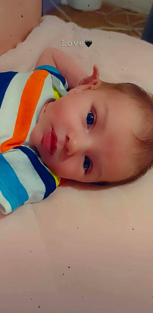 Phoenix is registered to the contest to win money with this photo: baby, baby_products, baby_toddler_clothing, bathing, cheek, chest, child, eyebrow, eyelash, happy, headgear, iris, lip, neck, nose, pattern, person, skin, sleeve, throat