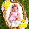 Kaiyah joined the competition — help win amazing prizes! baby, infant, basket, flower, pink_clothing, headband, grass, outdoor, yellow_flower, pink_flower, knitted_blanket, cute, portrait, newborn, sitting, nature, child, spring, floral_arrangement, wicker