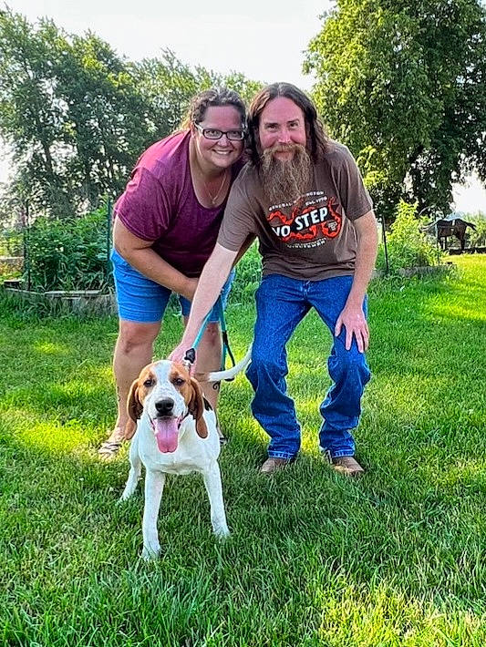 Maisey is registered to the contest to win money with this photo: beard, carnivore, chair, companion_dog, dog, dog_breed, fun, grass, grassland, happy, jeans, leisure, people_in_nature, plant, sky, smile, sporting_group, t_shirt, tail, tree