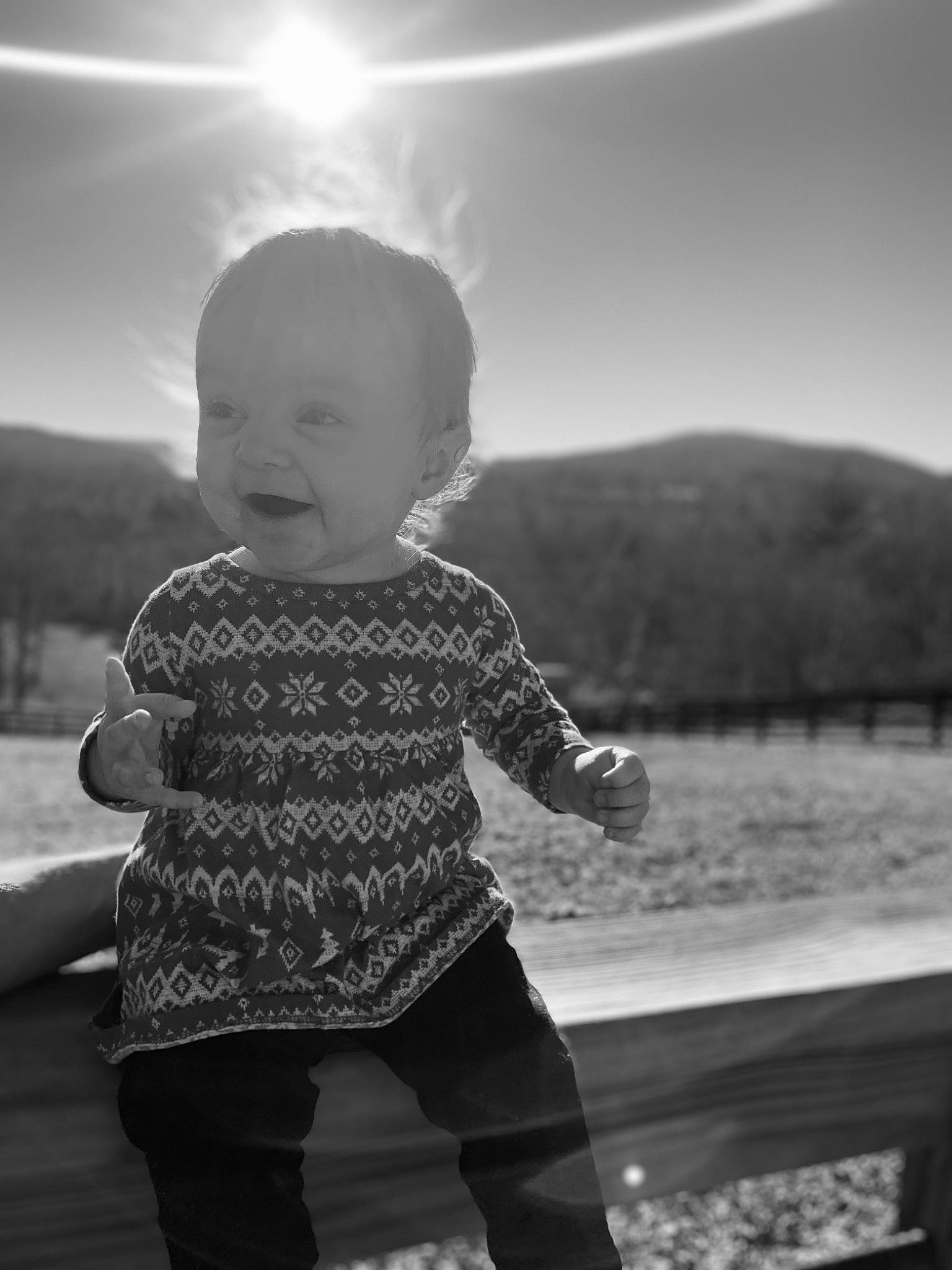 Nevaeh joined the competition — help win amazing prizes! black, black_and_white, cloud, cool, flash_photography, fun, gesture, grass, happy, light, people_in_nature, person, shoulder, sky, sleeve, smile, standing, style, sunlight, toddler