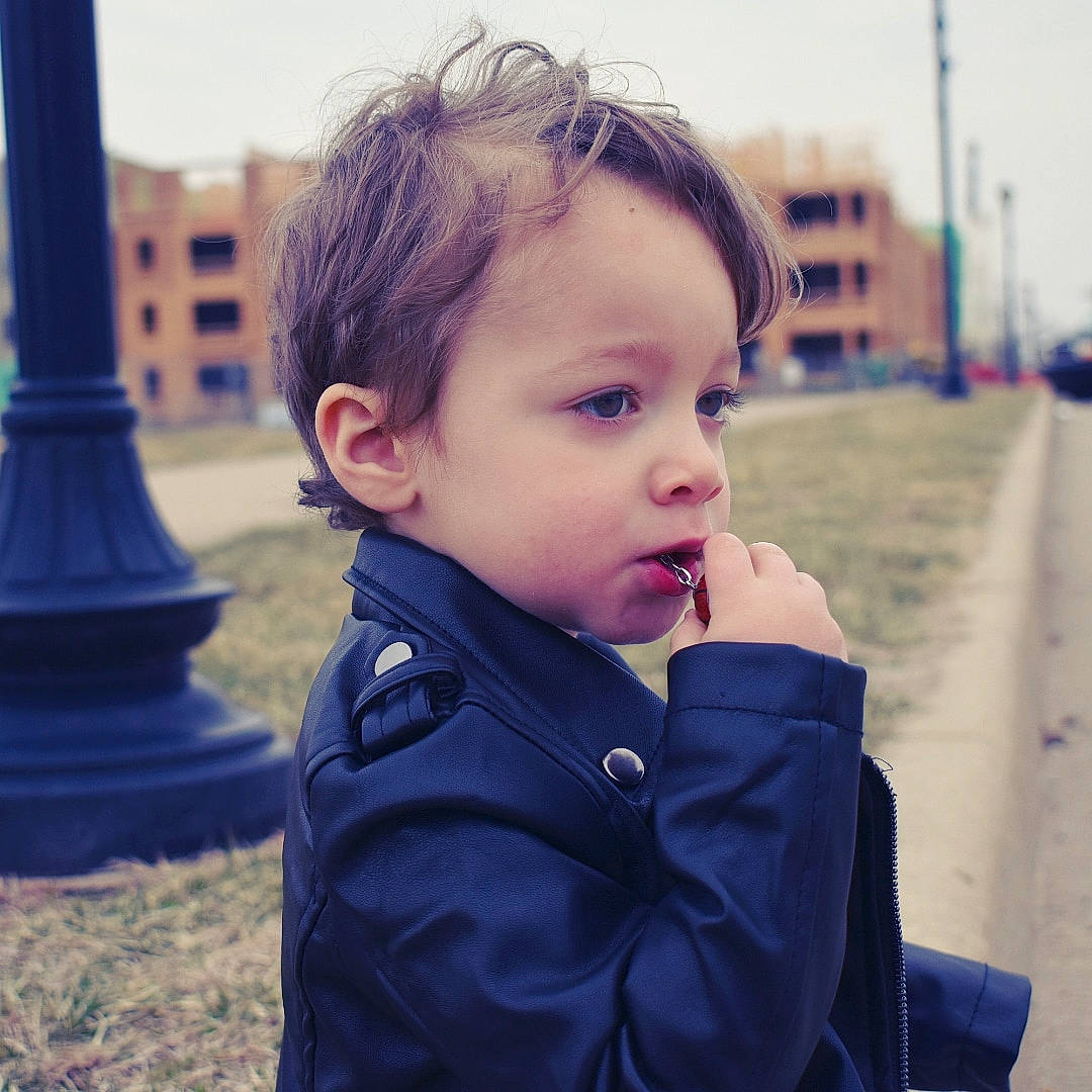 Kenton is registered to the contest to win money with this photo: baby, blue, cheek, child, cool, eye, face, forehead, hair, hairstyle, head, human, lip, male, neck, nose, outerwear, person, sky, snapshot