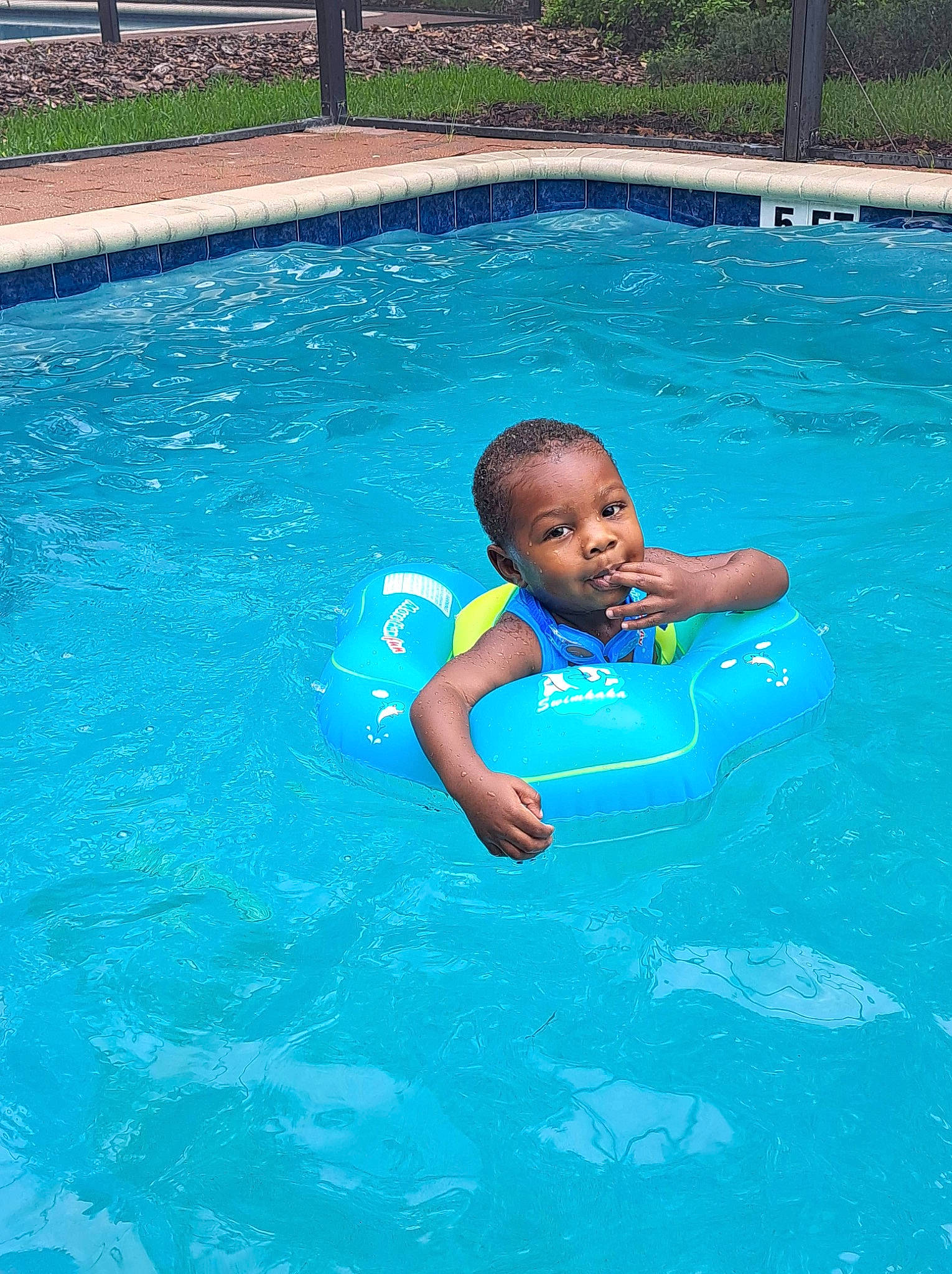 Malachi is registered to the contest to win money with this photo: aqua, azure, baby, bathing, child, electric_blue, fun, games, happy, leisure, leisure_centre, nonbuilding_structure, person, play, product, recreation, resort_town, swimming_pool, toddler, vacation