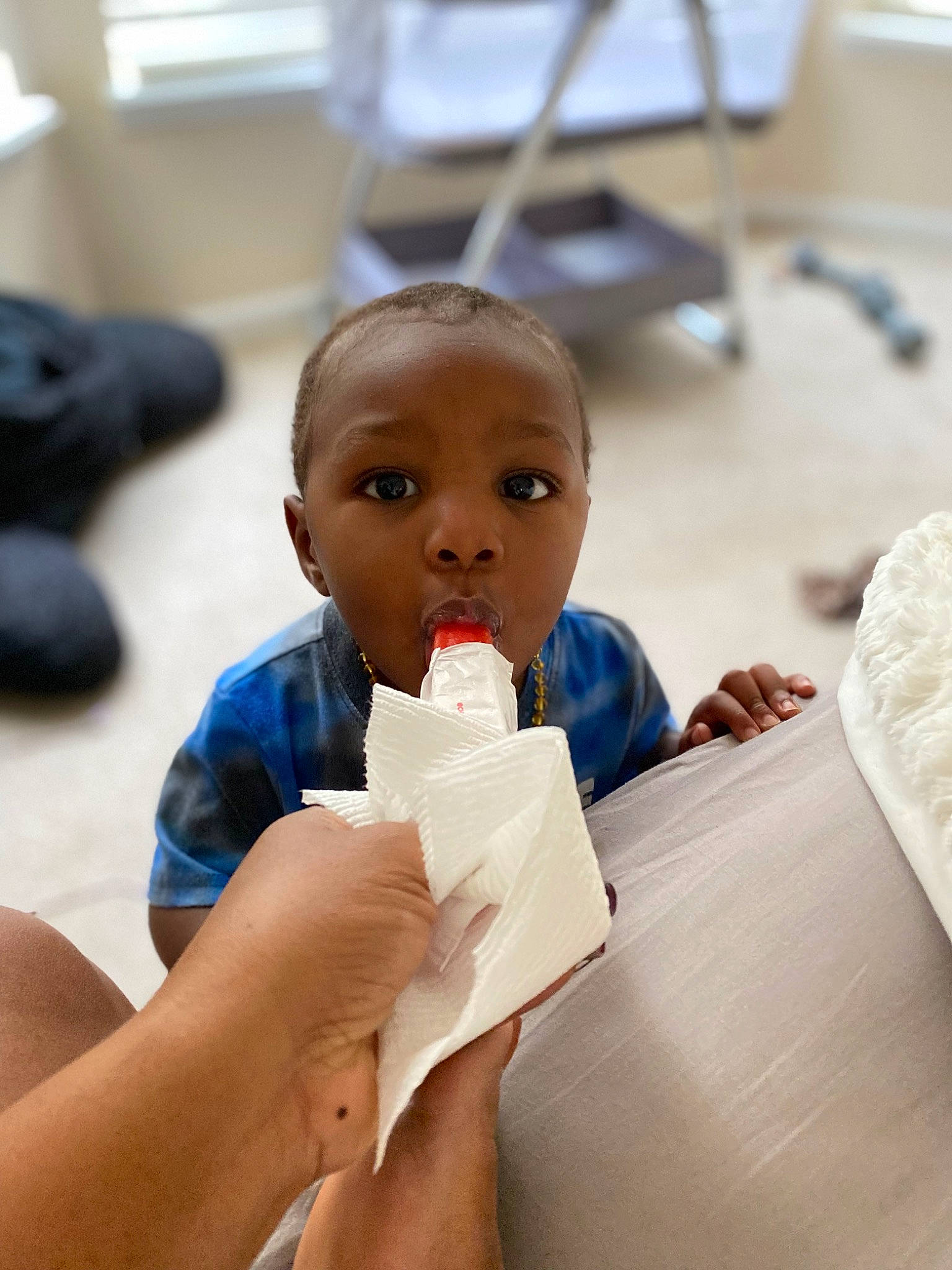 Malachi is registered to the contest to win money with this photo: baby, baby_products, baby_toys, child, comfort, eye, finger, flooring, gesture, hand, nail, person, plastic, play, room, sitting, thumb, toddler, toy, wood