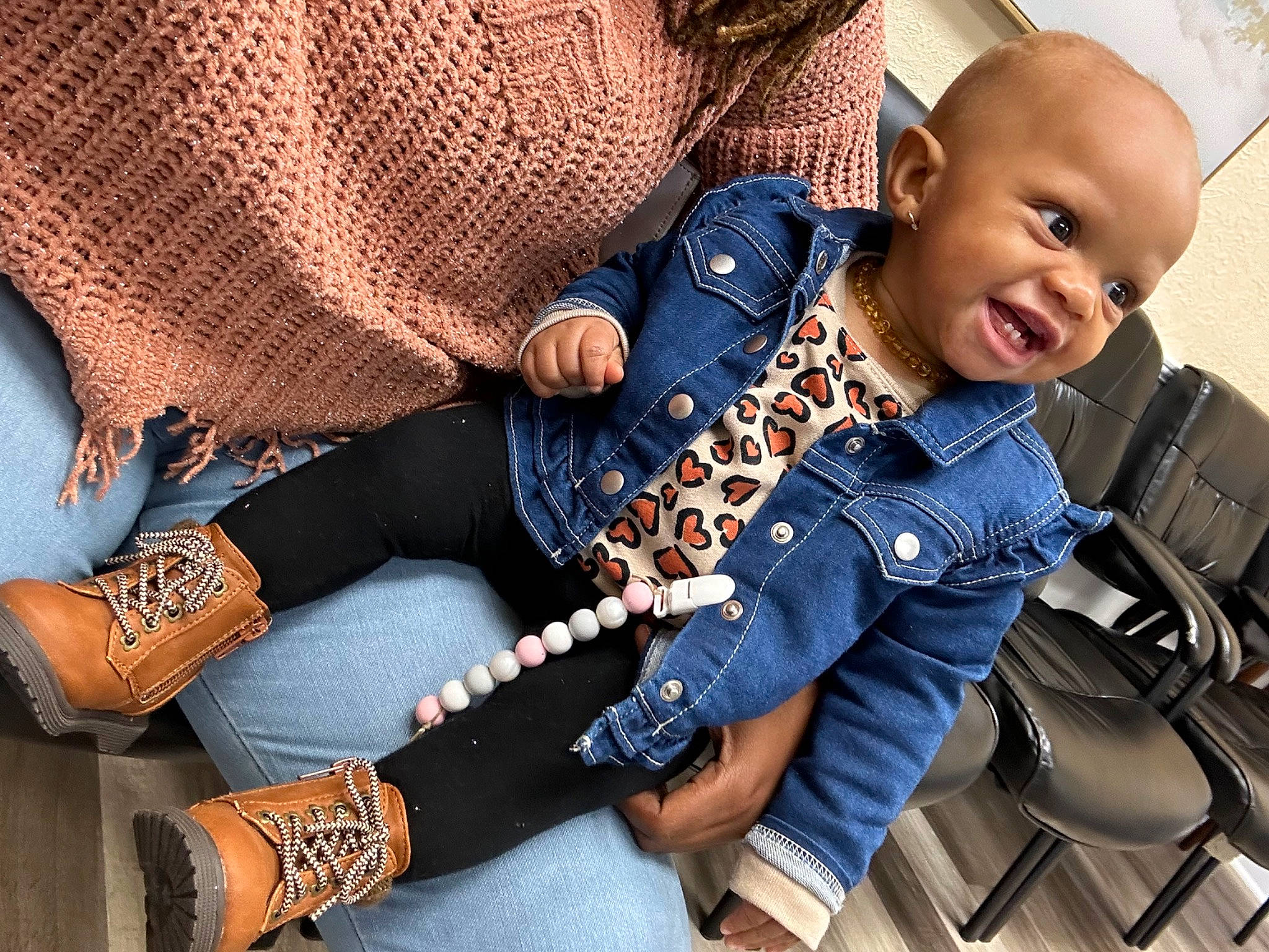 Journee is registered to the contest to win money with this photo: baby, baby_toddler_clothing, bag, car_seat, comfort, denim, electric_blue, eyewear, fashion_accessory, human_leg, knee, pattern, person, sitting, sleeve, smile, textile, thigh, toddler, travel