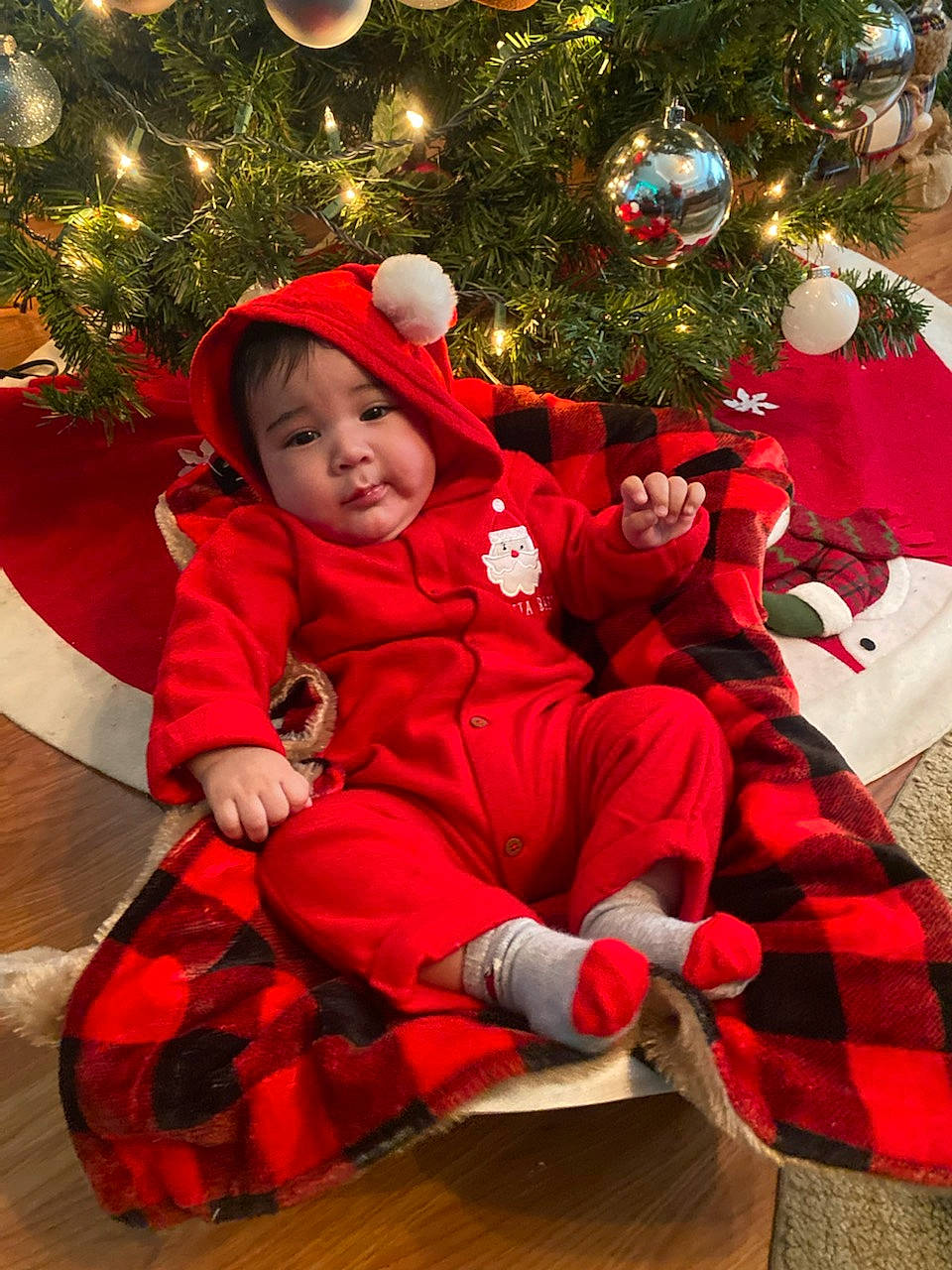 Ryan is registered to the contest to win money with this photo: baby, child, christmas, christmas_decoration, christmas_eve, christmas_ornament, christmas_tree, event, happy, headwear, holiday, holiday_ornament, human_body, lap, ornament, person, plant, smile, toddler, tree