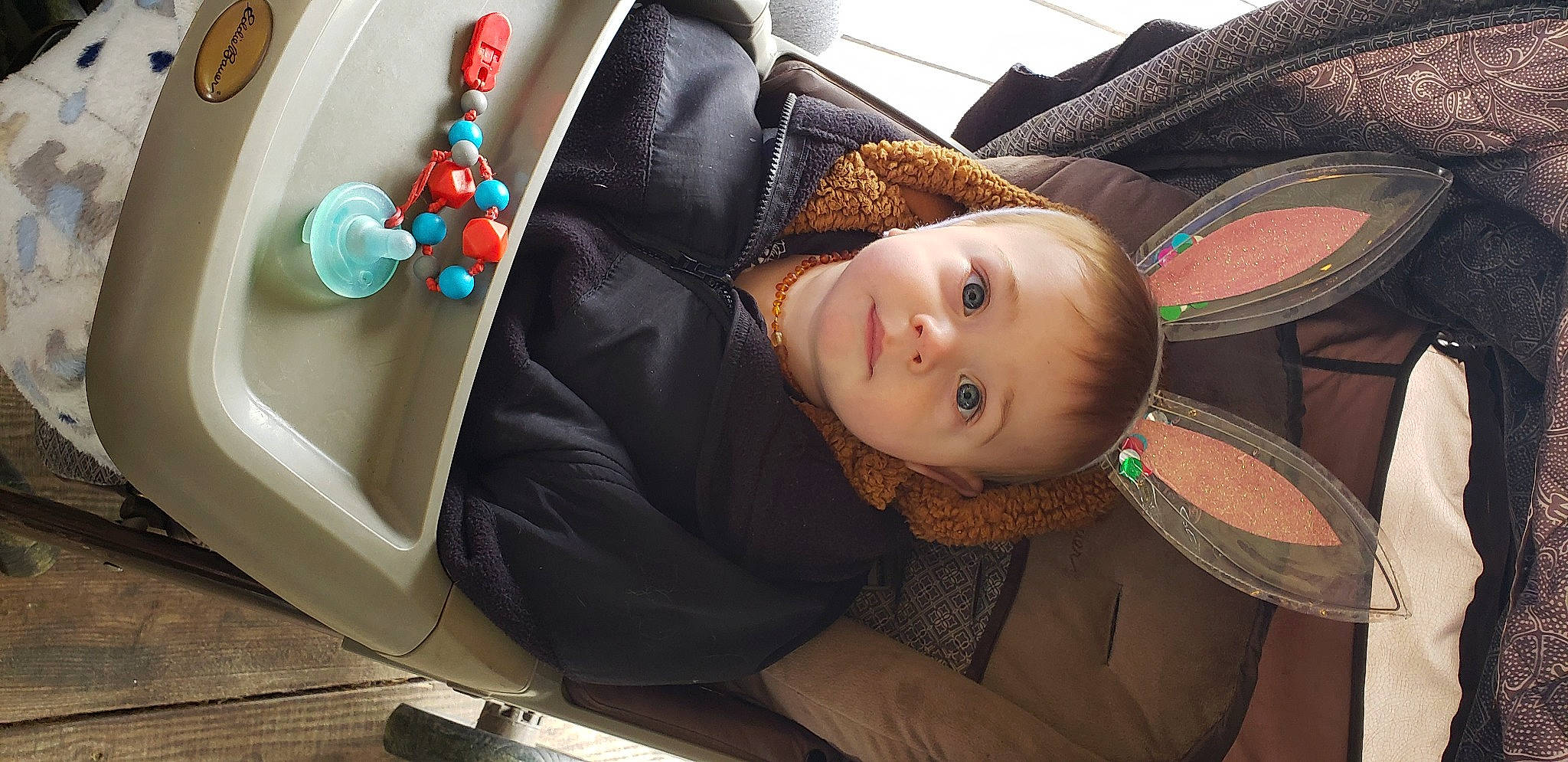 Malaki is registered to the contest to win money with this photo: arm, auto_part, baby_products, car_seat, chair, child, comfort, cool, couch, electric_blue, fashion_accessory, fun, headgear, leisure, mouth, person, room, sitting, smile, textile