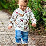 Milo participe au concours pour gagner de l'argent avec cette photo : animal_print, boots, casual_clothing, child, cute, daylight, forest, greenery, happy, jeans, nature, outdoor, pathway, person, portrait, scenic, sweater, toddler, walking, young_child
