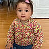 baby, casual, child, clothing, cute, expression, feet, floor, floral_shirt, hands, indoor, jeans, looking_at_camera, person, pink_bow, portrait, sitting, toddler, wooden_floor, young_child