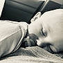 baby, sleeping, pacifier, closeup, black_and_white, child, infant, peaceful, soft_texture, clothing, face, portrait, cute, resting, young_child, monochrome, calm, comfort, head, eyelashes