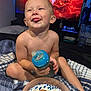 Weston joined the competition — help win amazing prizes! toddler, child, baby_bottle, plate, food, bed, blanket, television, animation, fire, indoor, smiling, tongue_out, sitting, cute, happy, casual, person, room, cozy