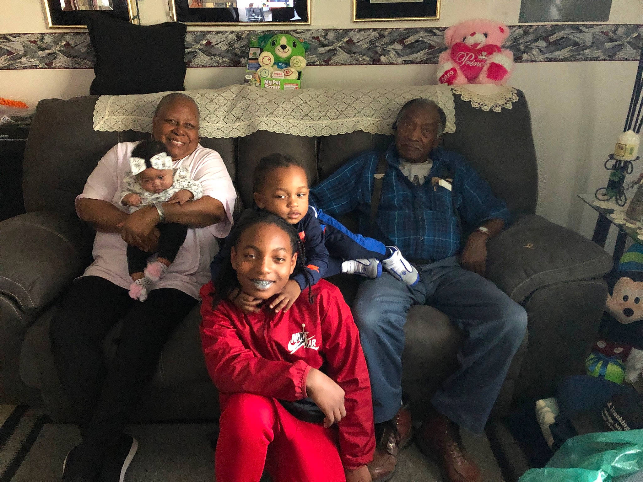 Vontrell joined the competition — help win amazing prizes! child, comfort, community, couch, event, facial_expression, fashion, fun, green, hairstyle, happy, headwear, human, joy, lap, leisure, living_room, people, person, sharing