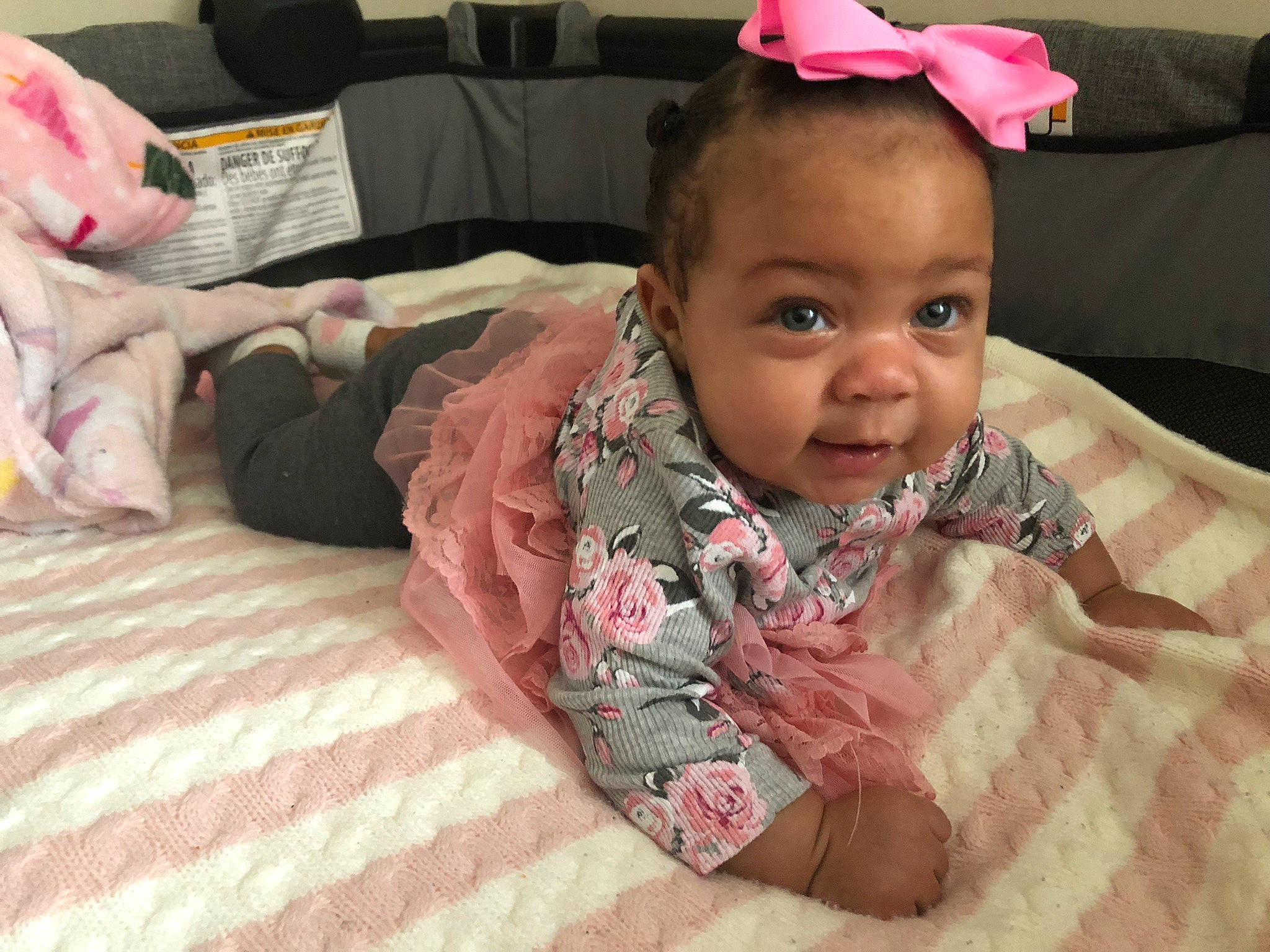 Brielle joined the competition — help win amazing prizes! baby, baby_toddler_clothing, cheek, child, comfort, couch, eye, eyebrow, face, happy, head, iris, linens, lip, mouth, person, pink, skin, smile, toddler