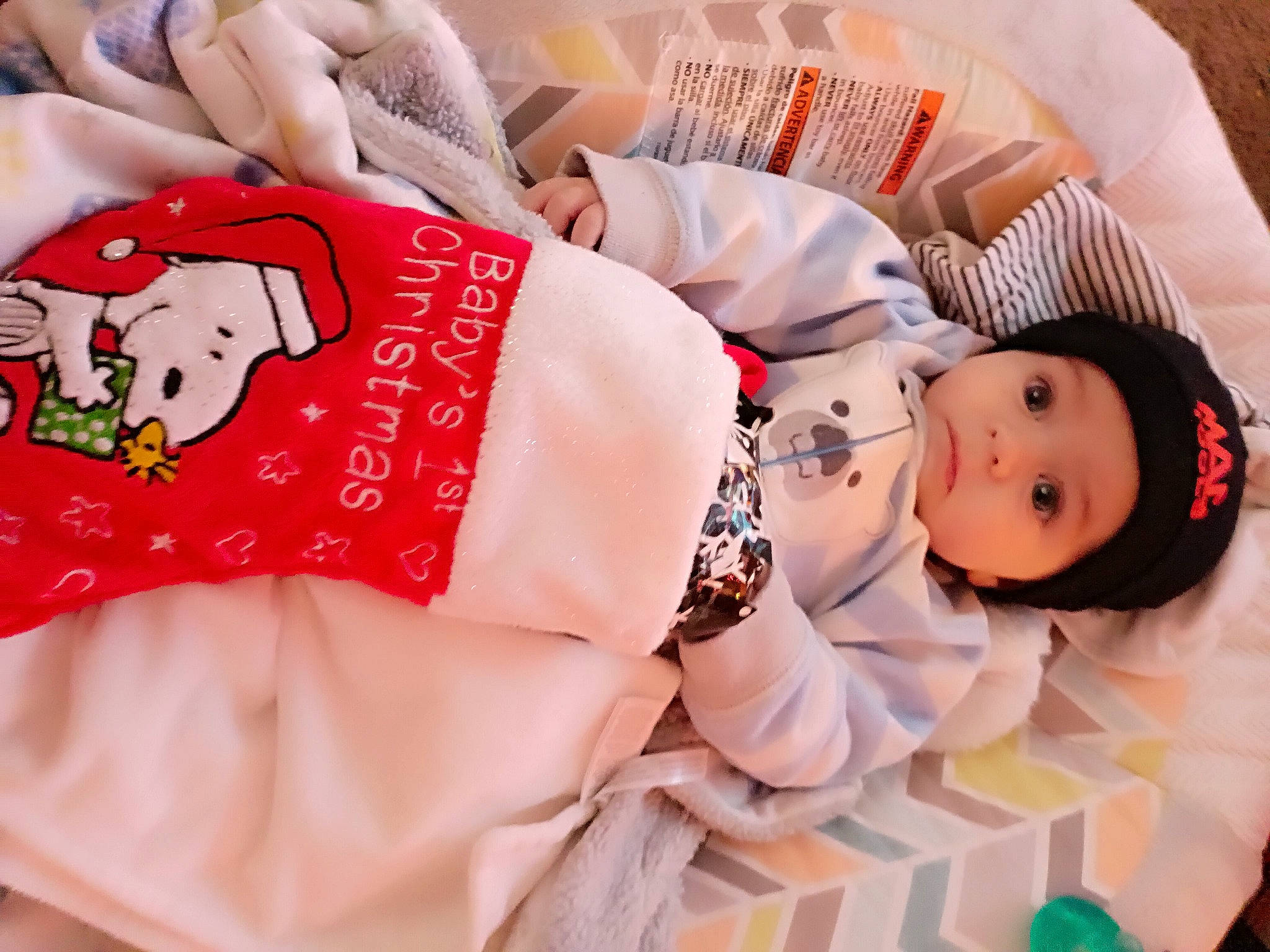 Dax is registered to the contest to win money with this photo: baby, baby_sleeping, baby_toddler_clothing, carmine, child, comfort, flesh, font, happy, hat, headwear, human_leg, linens, mammal, pattern, person, pink, room, skin, sleeve