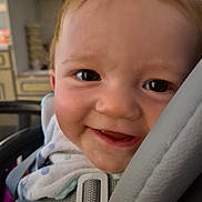 Liam Bedin participe au concours pour gagner de l'argent avec cette photo : baby, baby_clothes, car_seat, child, child_safety, close_up, clothing, expression, face, hair, happy, head, indoor, infant, person, seat, seatbelt, skin, smiling, transport