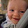 baby, baby_clothes, car_seat, child, child_safety, close_up, clothing, expression, face, hair, happy, head, indoor, infant, person, seat, seatbelt, skin, smiling, transport