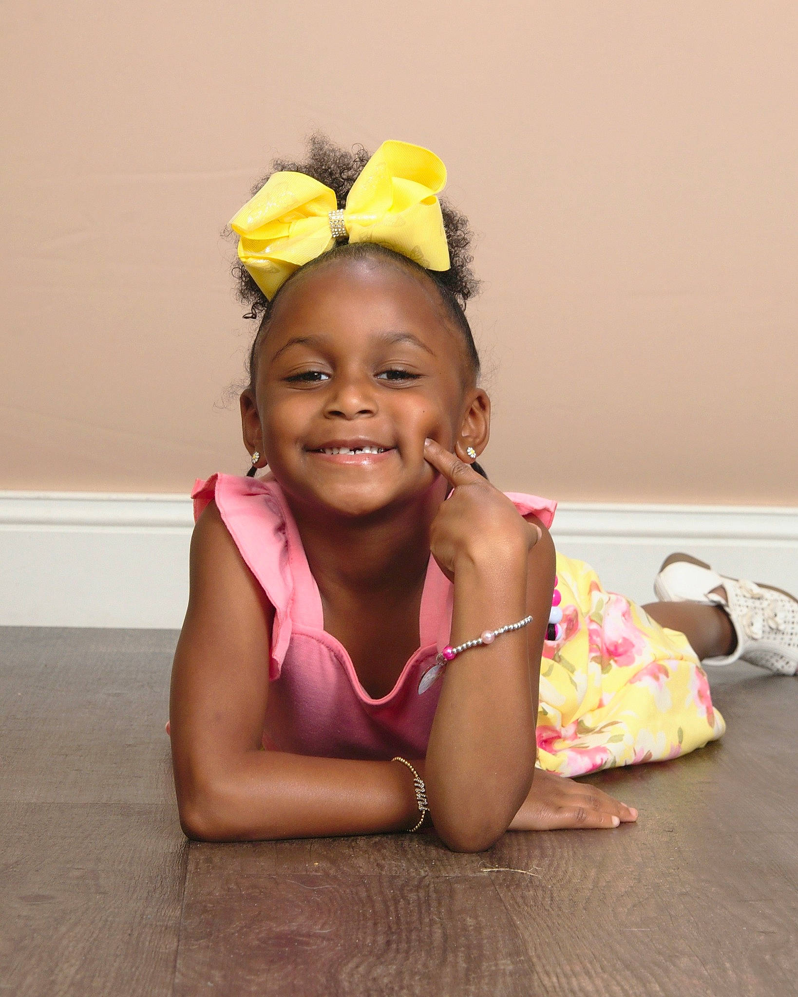 Sariah is registered to the contest to win money with this photo: abdomen, cheek, child, event, eye, fashion_accessory, floor, flooring, fun, hair_accessory, happy, headband, headpiece, jewellery, joy, person, pink, room, sitting, smile