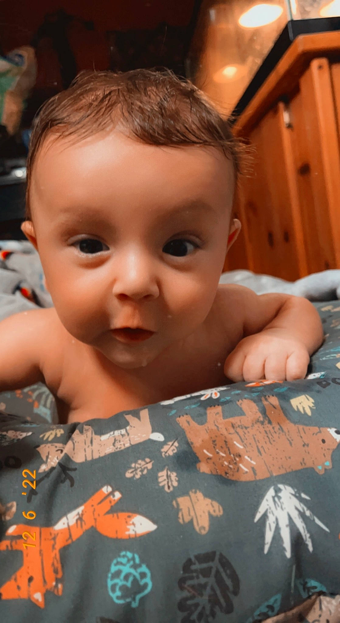 Joseph is registered to the contest to win money with this photo: baby, baby_toddler_clothing, cheek, child, chin, close_up, eyebrow, eyelash, finger, forehead, fun, hair, iris, lip, military_camouflage, mouth, nose, person, skin, smile