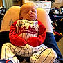 Isaiah is registered to the contest to win money with this photo: baby, sleeping, infant, clothing, striped_outfit, red_sleeves, person, legs, lap, indoor, dresser, door, room, furniture, tattoo, sleep, newborn, cute, cozy, casual