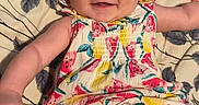 Pearllynn joined the competition — help win amazing prizes! baby, infant, smiling, headband, bow, colorful_clothing, watermelon_pattern, floral_blanket, laying_down, happy, cute, child, playful, legs, arms, skin, face, indoors, portrait, person