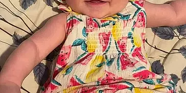 Pearllynn joined the competition — help win amazing prizes! arms, baby, bow, child, colorful_clothing, cute, face, floral_blanket, happy, headband, indoors, infant, laying_down, legs, person, playful, portrait, skin, smiling, watermelon_pattern