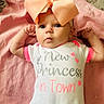 Pearllynn joined the competition — help win amazing prizes! baby, infant, child, bow, onesie, pink, blanket, face, portrait, cute, newborn, expression, lying_down, clothing, headband, soft_texture, baby_girl, small_hands, indoor, skin