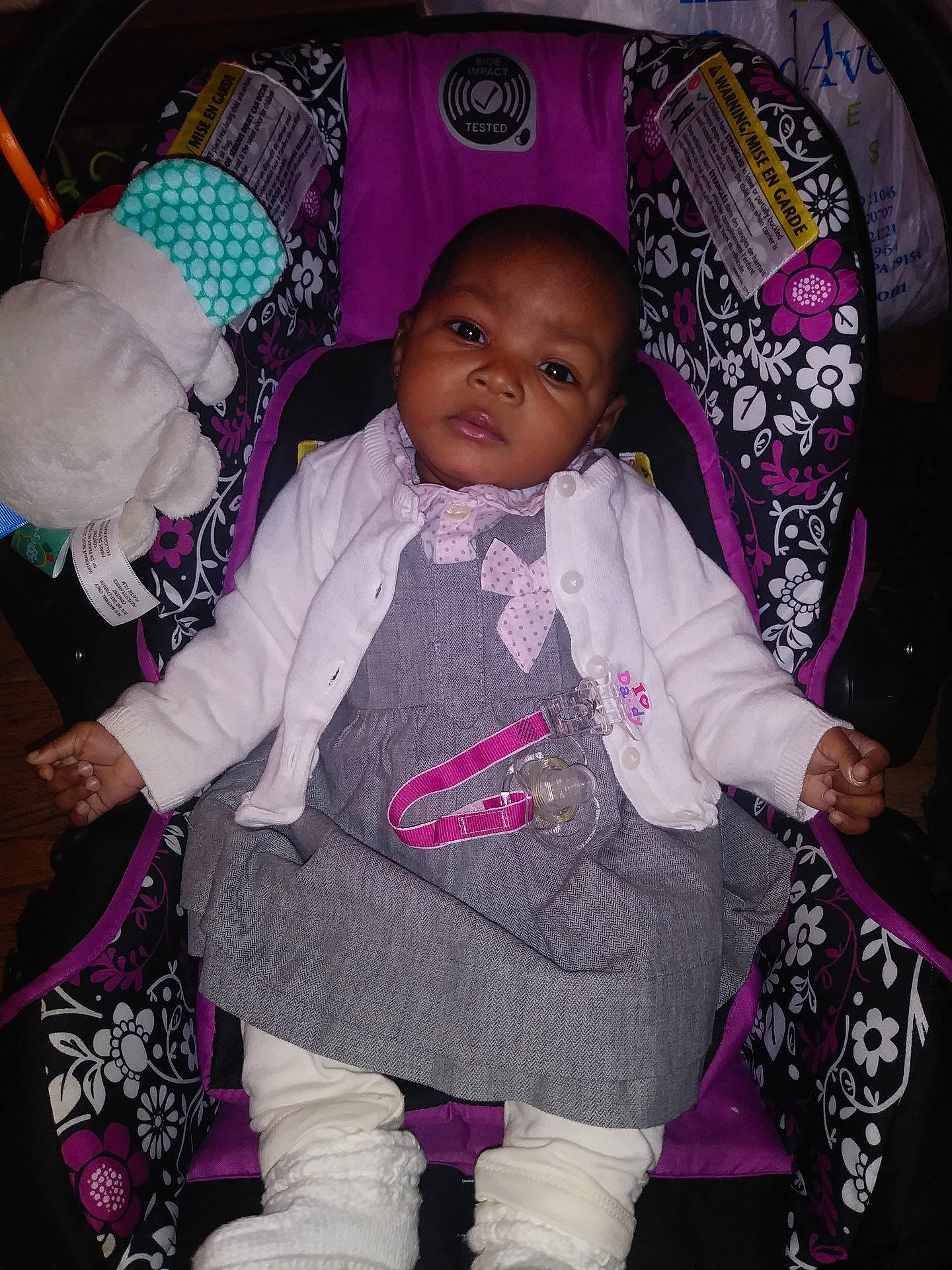 Anika is registered to the contest to win money with this photo: baby_products, car_seat, child, cool, fun, girl, human, infant, person, pink, product, purple, skin, smile, textile, toddler