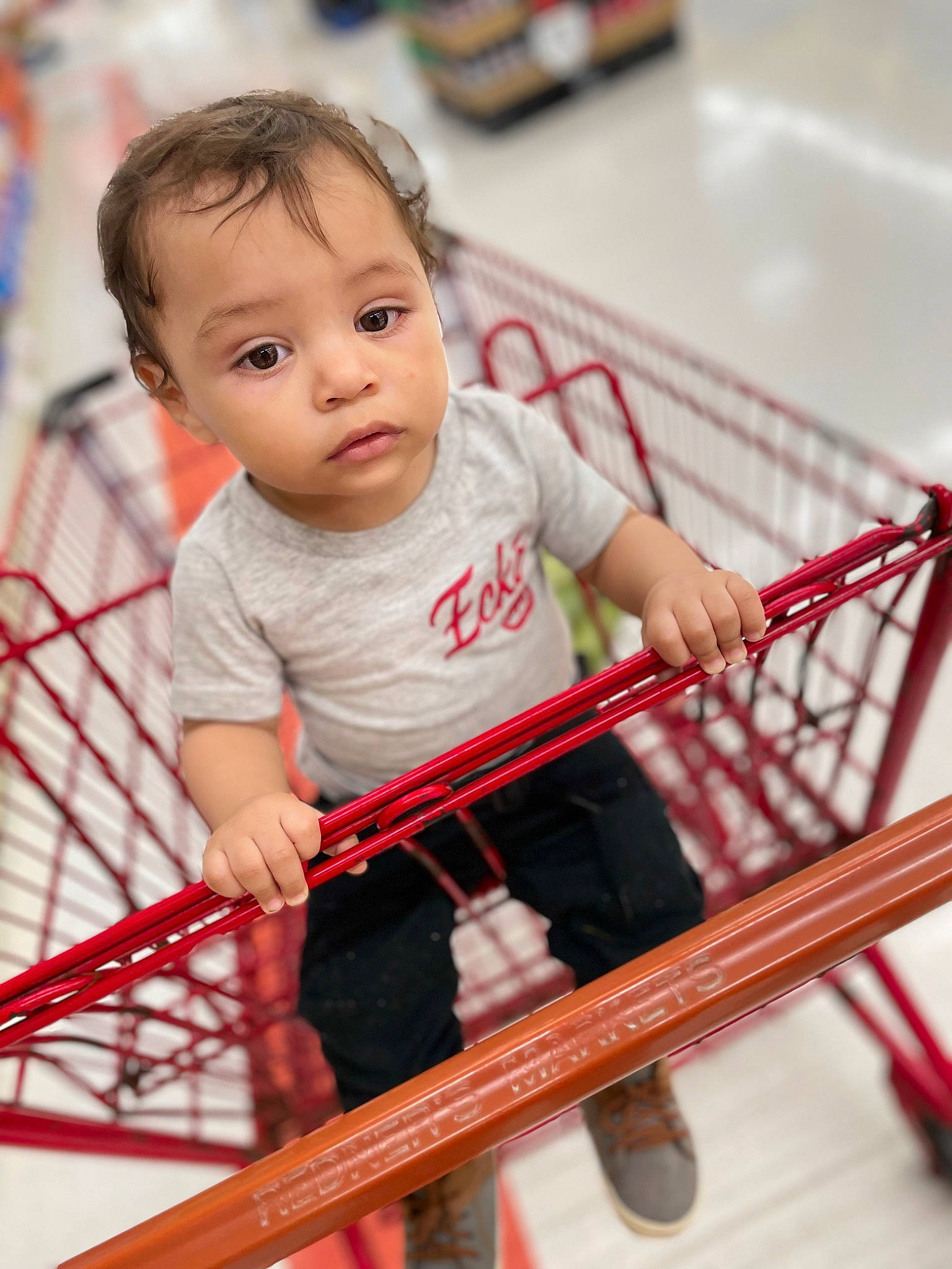 Eduardo joined the competition — help win amazing prizes! baby, baby_toddler_clothing, cheek, child, facial_expression, flooring, fun, happy, human_body, human_leg, leisure, pattern, person, play, shopping_cart, shorts, sitting, skin, sleeve, t_shirt