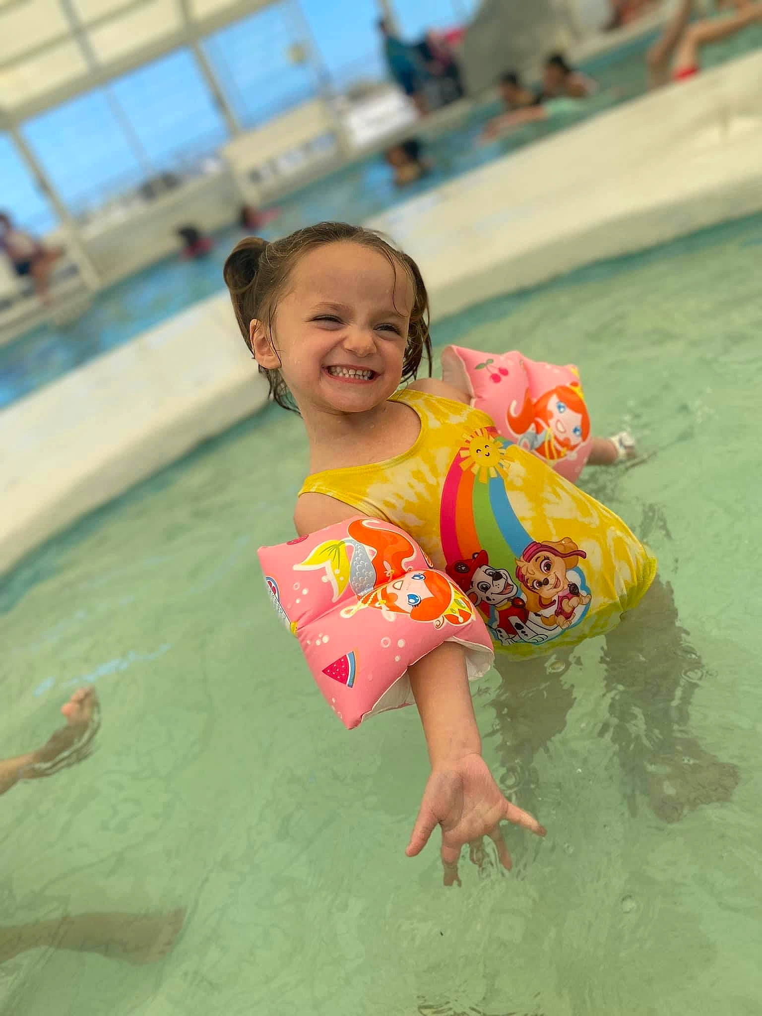 Kenz'Lee joined the competition — help win amazing prizes! aqua, baby_float, bathing, body_of_water, child, facial_expression, fun, happy, joy, leisure, person, personal_protective_equipment, recreation, sand, skin, sky, smile, summer, swimming_pool, toddler