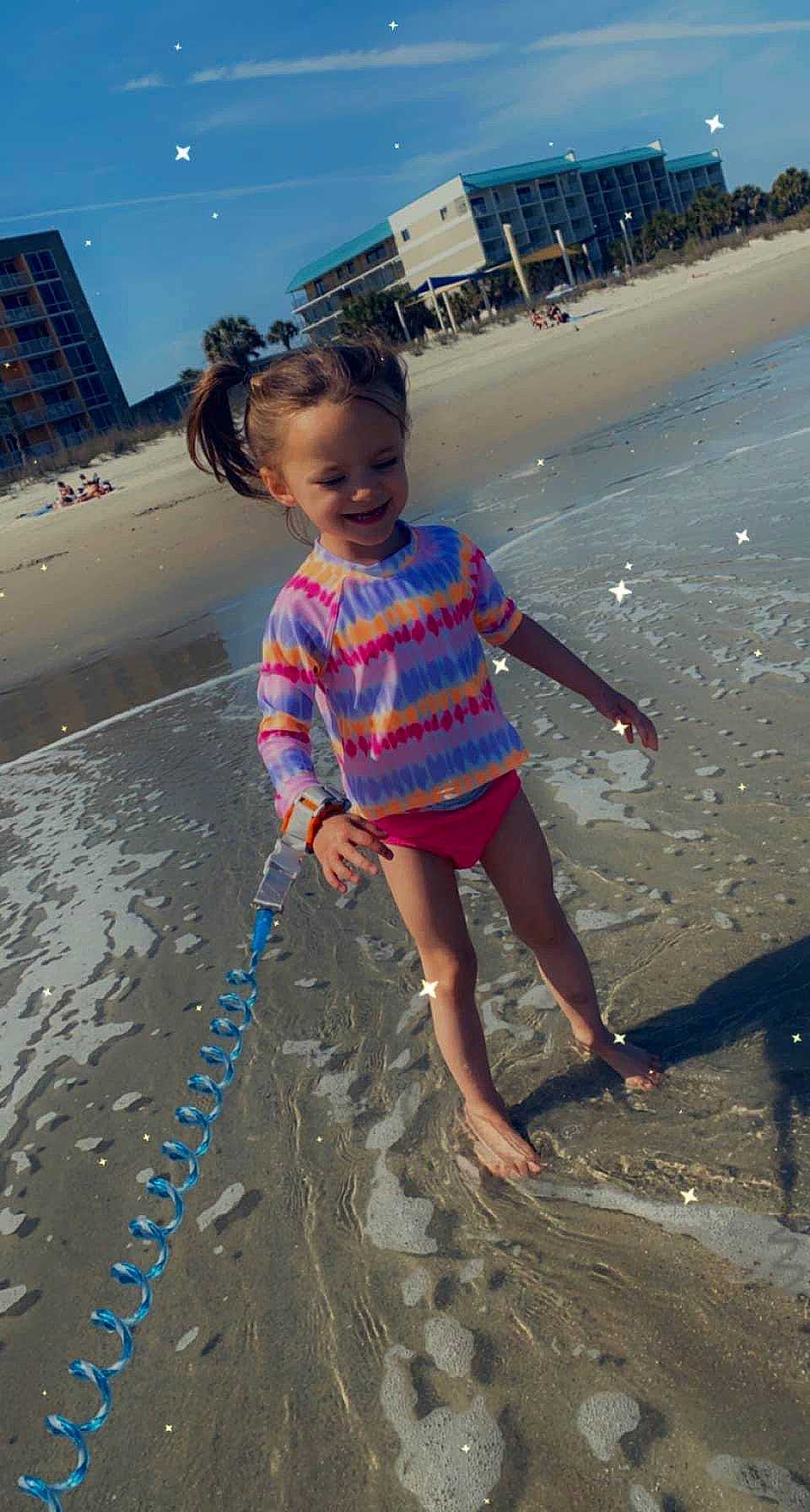 Kenz'Lee is registered to the contest to win money with this photo: asphalt, azure, barefoot, beach, child, city, electric_blue, foot, fun, happy, joy, leisure, people_in_nature, people_on_beach, person, sand, sandal, shore, sky, toddler