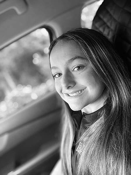 Roxy is registered to the contest to win money with this photo: automotive_design, beauty, black, black_and_white, black_hair, chin, eyebrow, face, flash_photography, fun, happy, iris, joy, lip, long_hair, monochrome, monochrome_photography, nose, person, personal_luxury_car