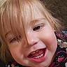 baby, blonde_hair, cheerful, child, closeup, clothing, cute, expression, face, floral_pattern, happy, indoor, joy, person, portrait, skin, smile, teeth, toddler, young_child