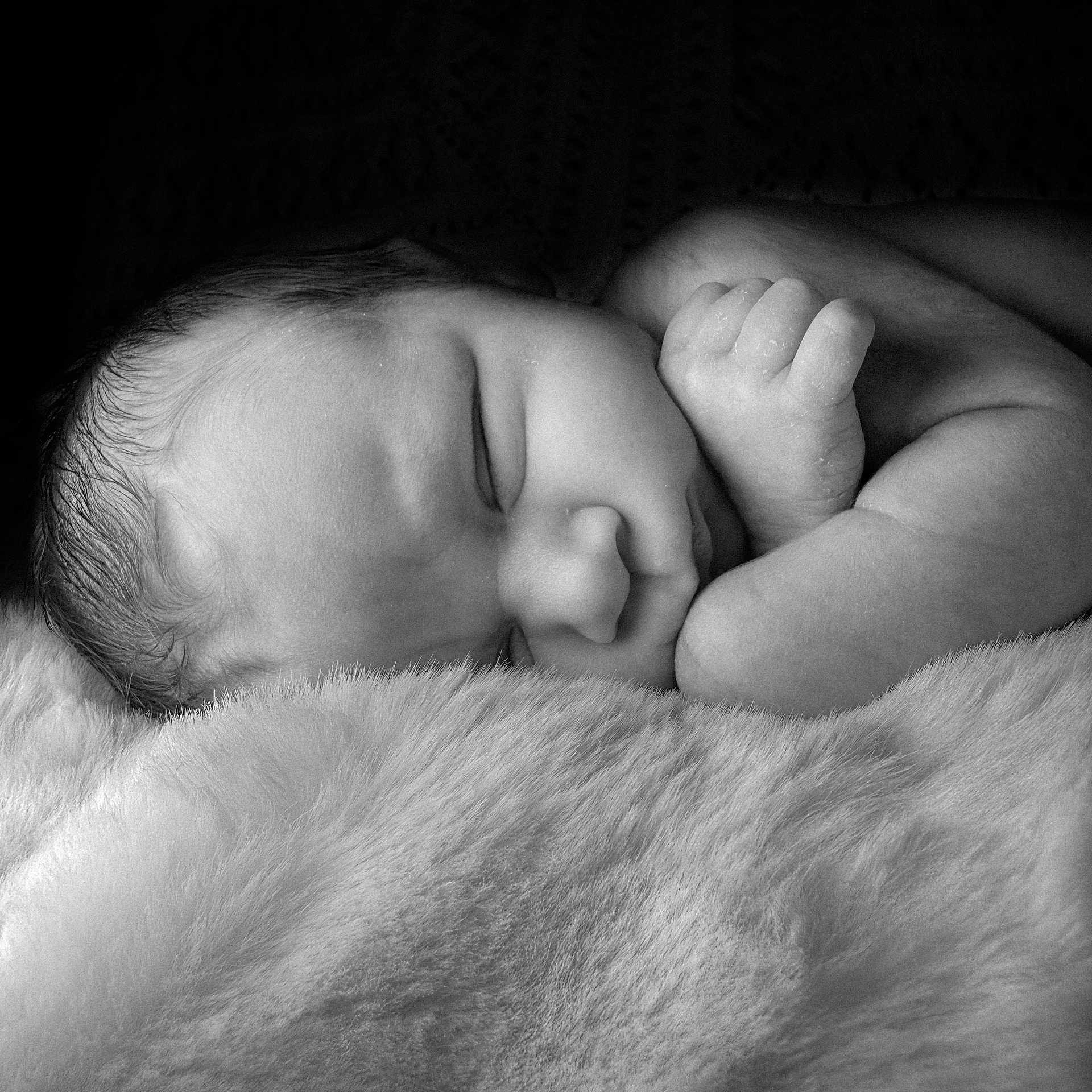 Albie is registered to the contest to win money with this photo: newborn, baby, sleeping, infant, black_and_white, soft_texture, blanket, peaceful, closeup, face, hand, skin, portrait, rest, cute, young, child, tender, cozy, sleep