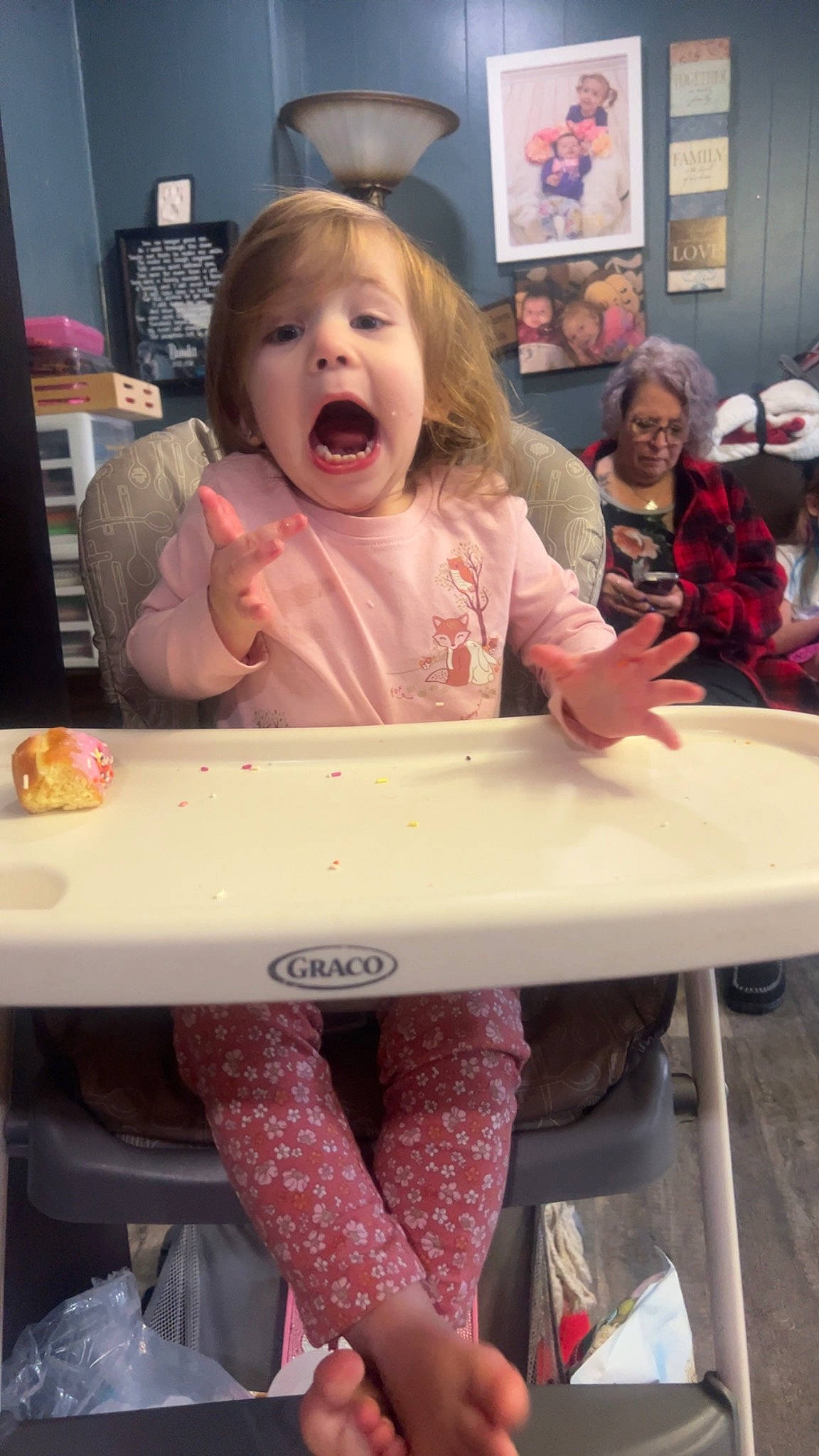 Larsyn is registered to the contest to win money with this photo: baby, carmine, child, event, face, facial_expression, fun, hairstyle, happy, hat, mouth, organ, person, pink, red, room, sitting, snapshot, surprise, t_shirt