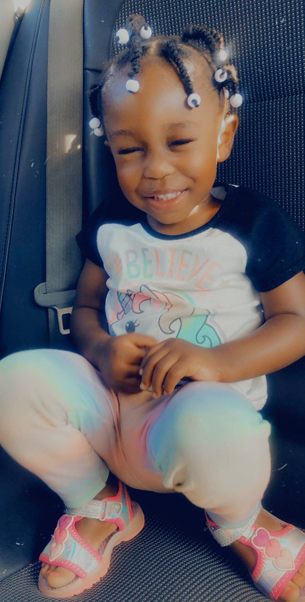 Amyah is registered to the contest to win money with this photo: abdomen, arm, baby, birth, black_hair, cheek, child, chin, happy, headwear, joy, leg, lip, person, sitting, skin, smile, toddler, trunk