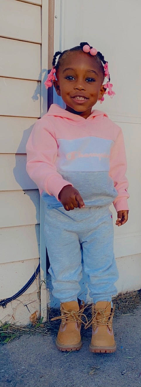 Amyah is registered to the contest to win money with this photo: baby, child, joy, outerwear, person, pink, sleeve, smile, standing, toddler