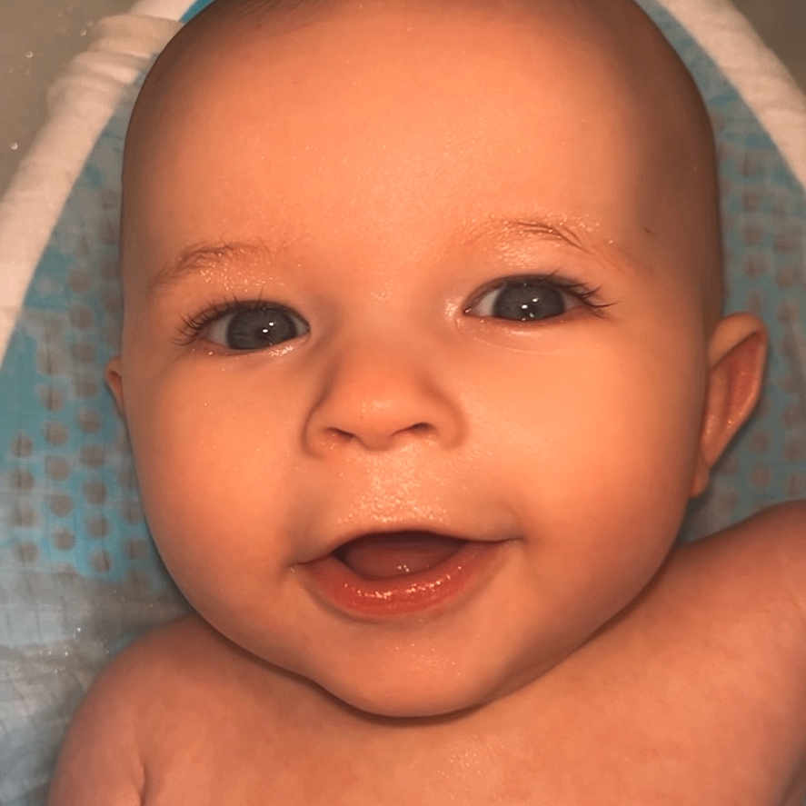 Lennox is registered to the contest to win money with this photo: baby, babylaughing, bathing, bathtub, bodypart, clothing, face, finger, hand, happy, hat, head, laughing, mouth, newborn, person, photography, portrait, smile, tub