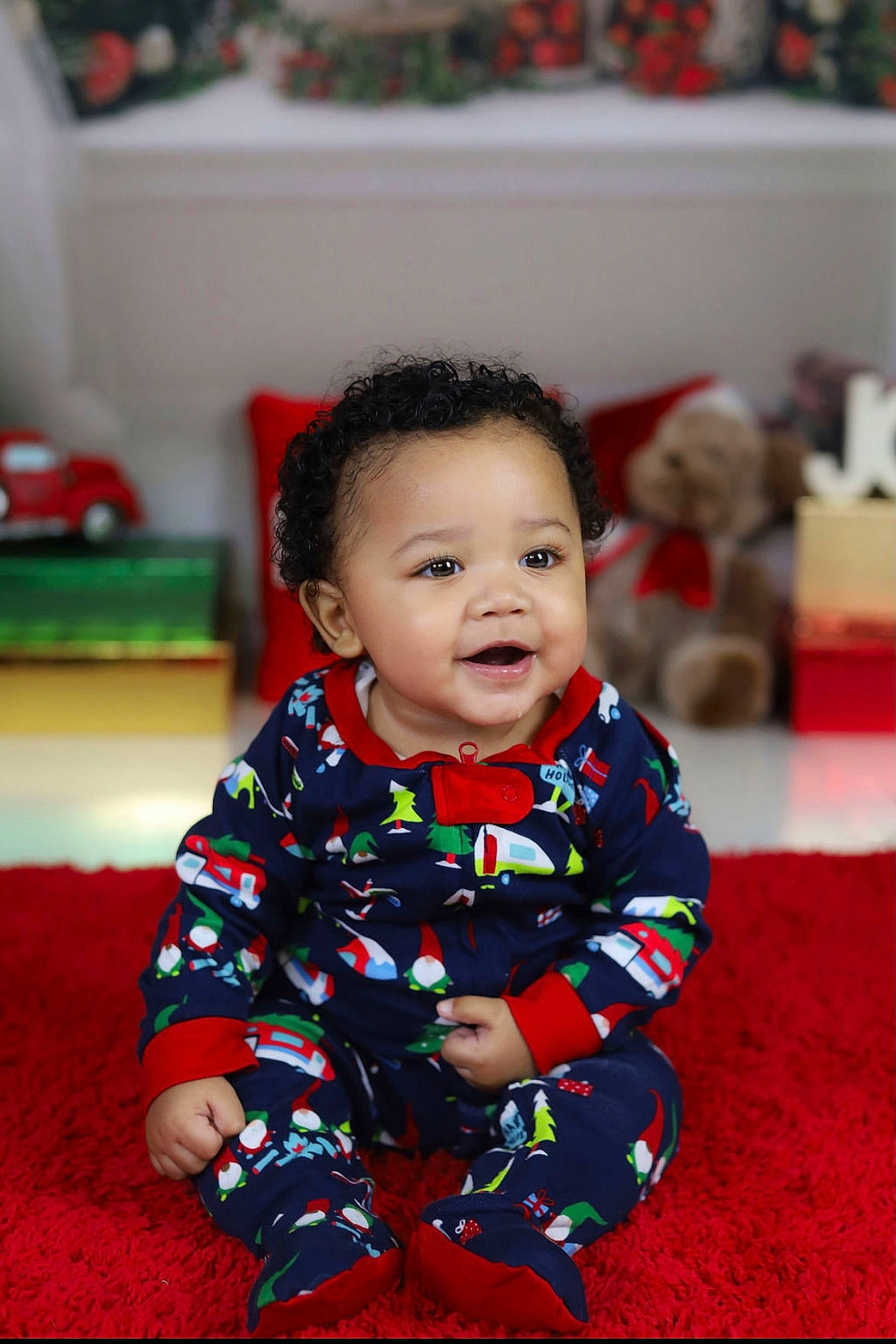 Kovie is registered to the contest to win money with this photo: baby, baby_toddler_clothing, cheek, child, event, eye, face, facial_expression, floor, flooring, fun, happy, head, leisure, pattern, person, sitting, sleeve, smile, toddler