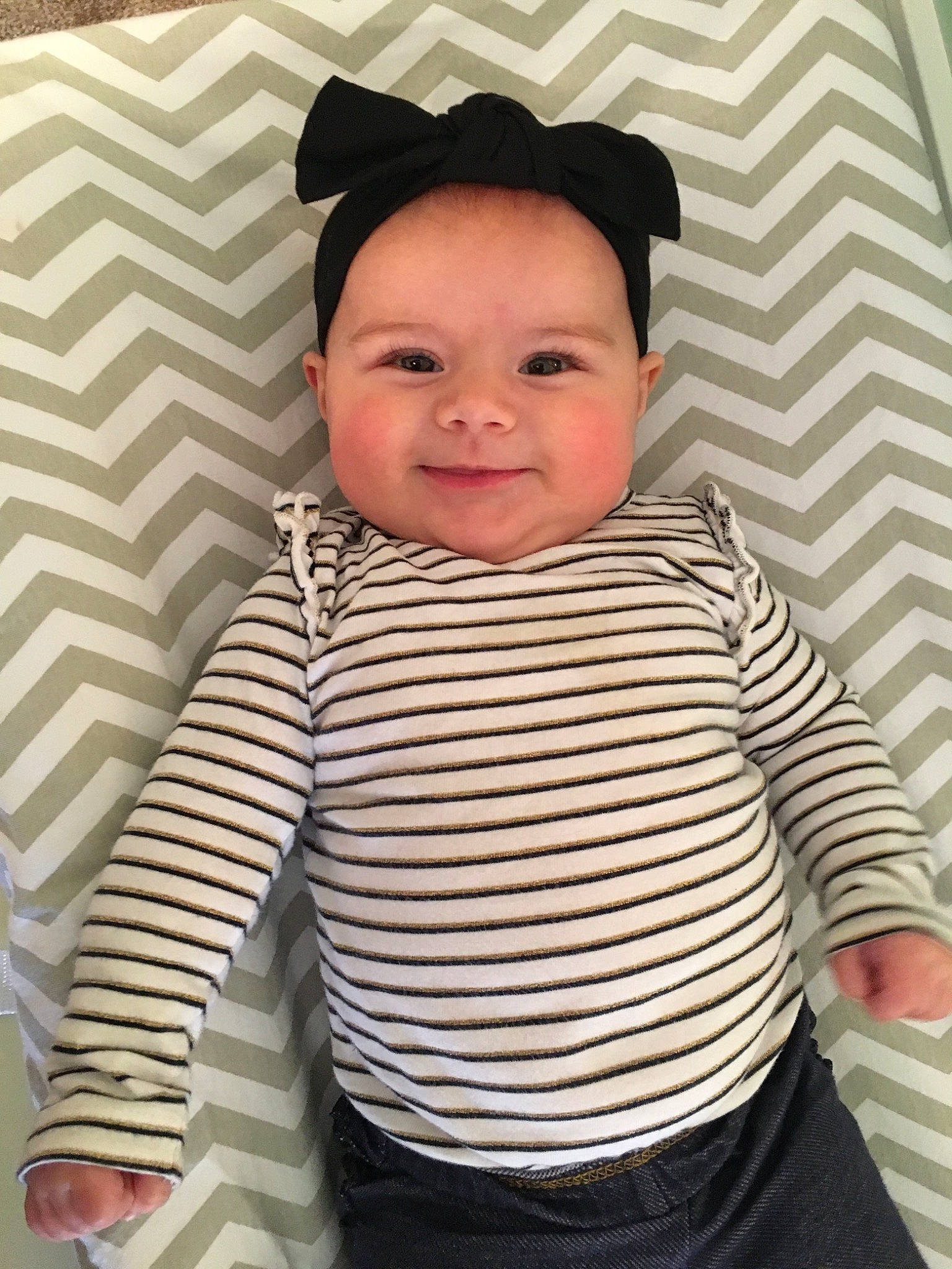 Ellyanna is registered to the contest to win money with this photo: baby, baby_toddler_clothing, child, headgear, outerwear, pattern, person, sleeve, smile, t_shirt, toddler