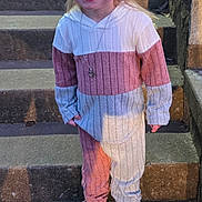 Paige joined the competition — help win amazing prizes! child, smiling, stairs, outdoor, pink_shoes, hoodie, long_hair, casual_clothing, happy, portrait, young_child, concrete, steps, fashion, person, cute, daylight, accessory, necklace, full_body