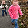Paige is registered to the contest to win money with this photo: toddler, child, outdoor, sidewalk, pink_hoodie, jacket, jeans, boots, grass, stone_wall, steps, house, necklace, smiling, walking, daylight, fall, leaves, person, cute