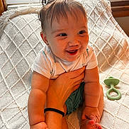 Mazy joined the competition — help win amazing prizes! baby, child, smiling, happy, person, infant, cute, hair, ponytails, hand, foot, blanket, pacifier, window, light, indoor, clothing, skin, holding, arm