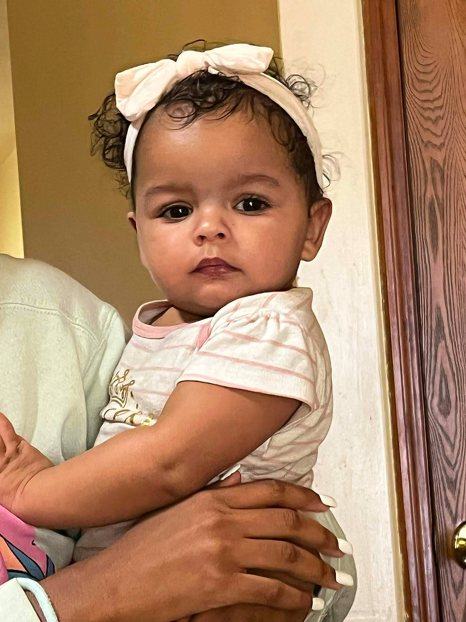 Carolina is registered to the contest to win money with this photo: arm, baby, baby_toddler_clothing, cheek, chin, dress, eye, eyelash, face, flash_photography, gesture, happy, head, iris, lip, neck, nose, person, skin, sleeve