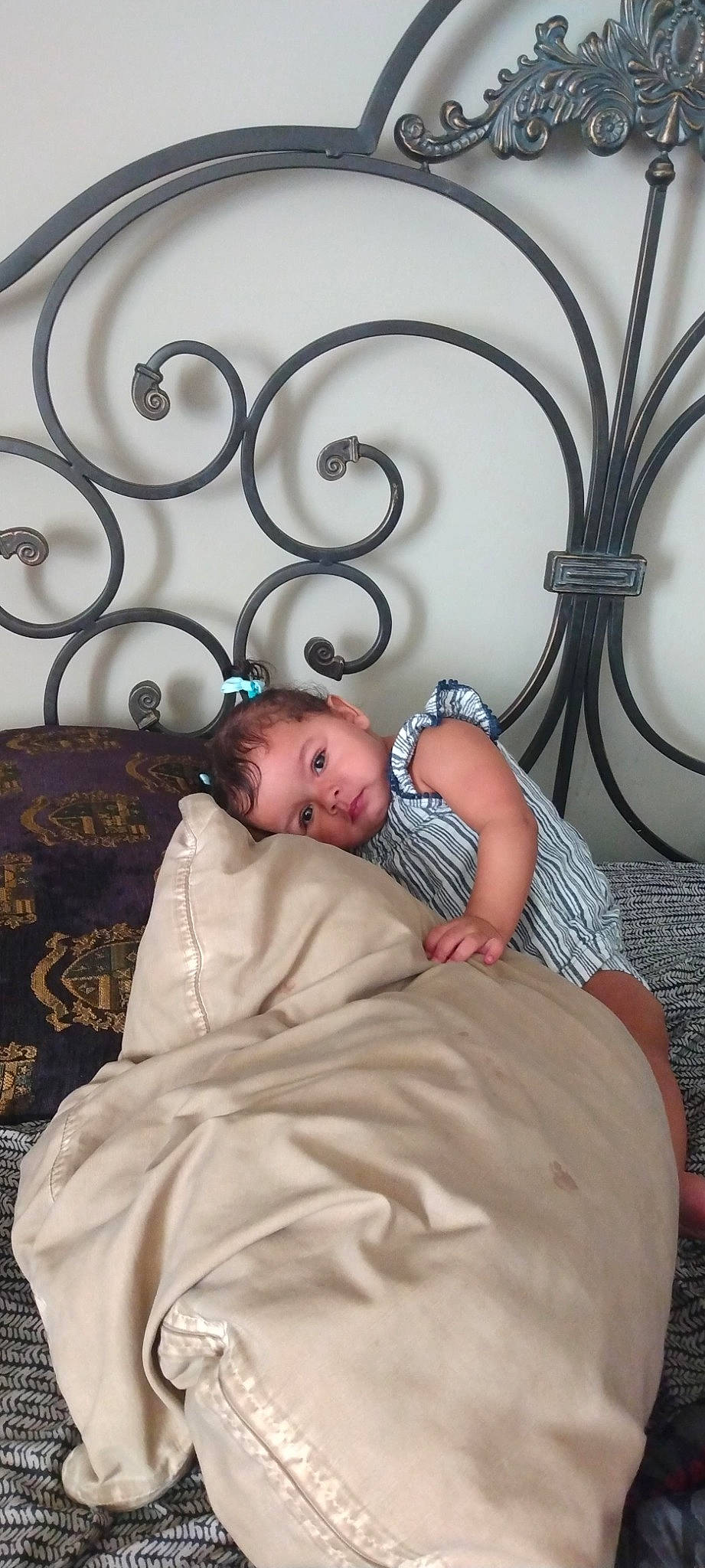 Carolina is registered to the contest to win money with this photo: baby, baby_toddler_clothing, cheek, child, comfort, couch, eye, fence, flash_photography, flooring, linens, metal, pattern, people, person, product, room, sitting, skin, toddler